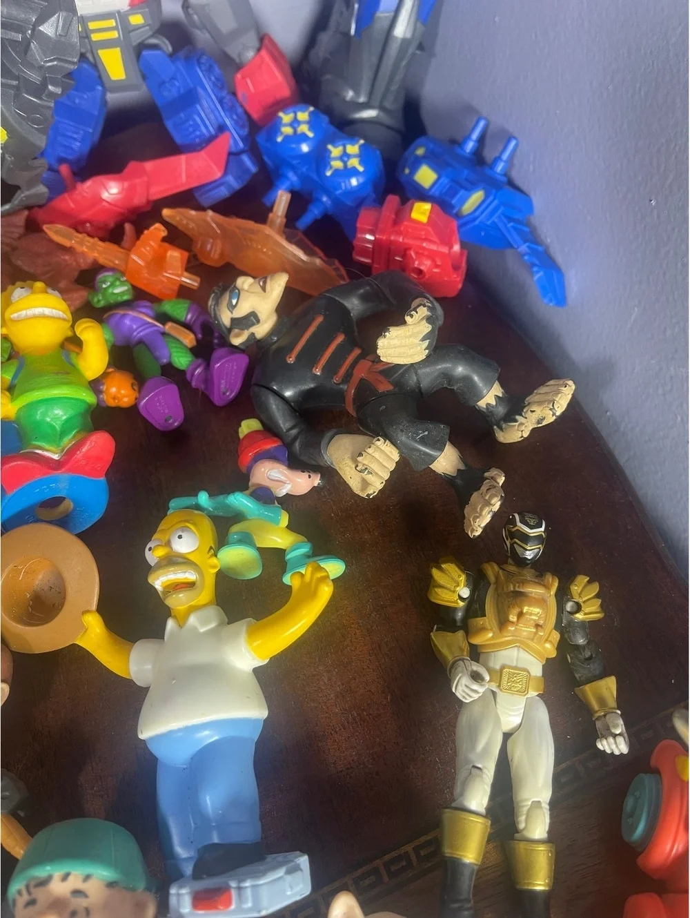 Mixed Lot of Vintage and Modern Action Figures Including Transformers, Simpsons,